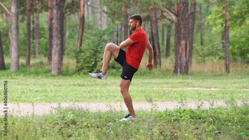 A man doing a warm-up before jogging in the forest. A man doing a warm-up before jogging in the forest.
