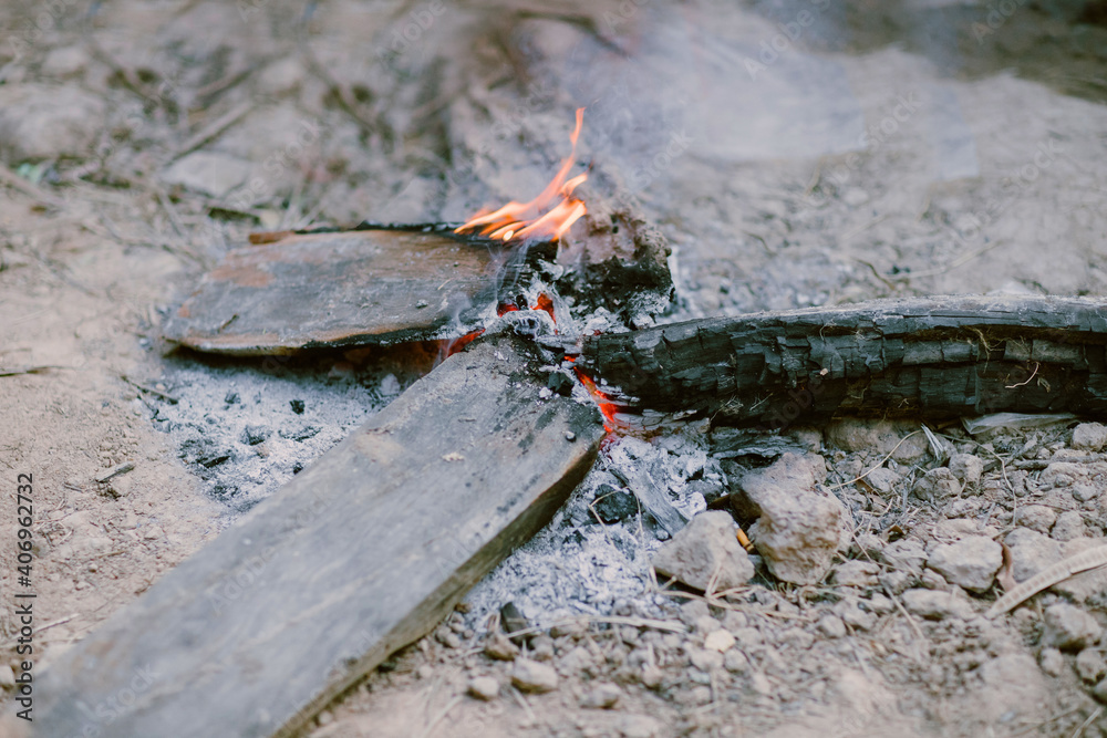 Fototapeta premium Build a fire on the ground in winter Along the countryside or in the forest Popular among nature tourism travelers