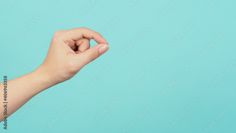 Empty Hand holding or catch nothing guesture on green and blue or mint background. Empty Hand holding or catch nothing guesture on green and blue or mint background.