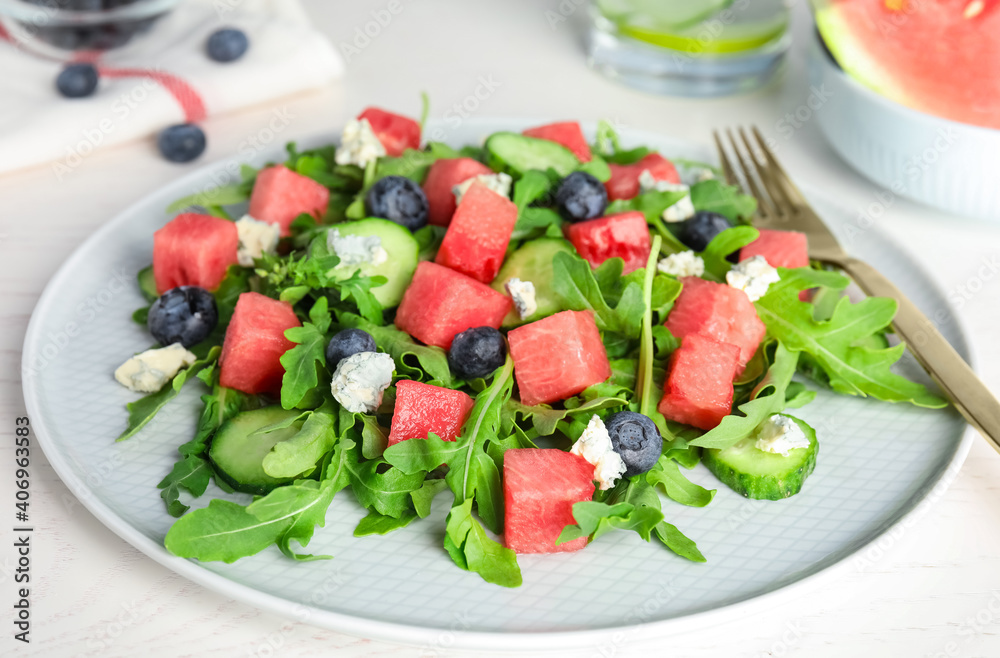 Delicious salad with watermelon served on white table, closeup