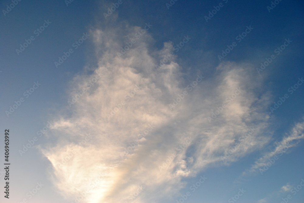 Wispy White Clouds in Blue Sky 