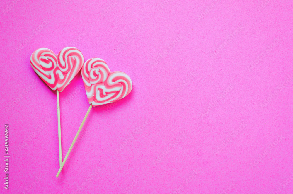 Festive pink background. Sweet heart shaped candies. Love. Valentine's Day. 14 of February. Flat lay, top view. Festive pink background. Sweet heart shaped candies. Love. Valentine's Day. 14 of February. Flat lay, top view.
