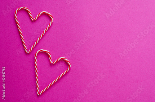 Festive pink background. Hearts of sweet candies. Love. Valentine s Day. 14 of February. Flat lay  top view.