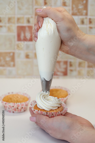 Homemade muffins for Valentine's Day. Photo 2: decorating with cream from a pastry bag. photo