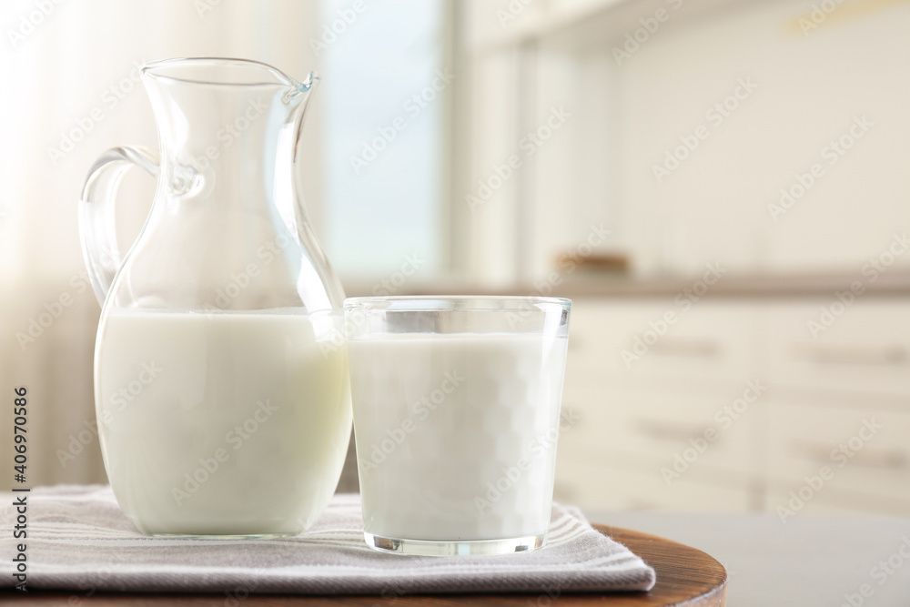 Delicious fresh milk on wooden table indoors. Space for text Delicious fresh milk on wooden table indoors. Space for text