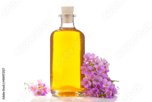 Essential oil of Arabis flower on a White background in beautiful bottle