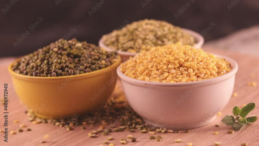 Broken Mung Lentils (yellow moong Dal) with green moong bean and mung daal,Falling Yellow moong dal,collection high protein moong dal,Indian pulse,top view moong bean and dal Broken Mung Lentils (yellow moong Dal) with green moong bean and mung daal,Falling Yellow moong dal,collection high protein moong dal,Indian pulse,top view moong bean and dal