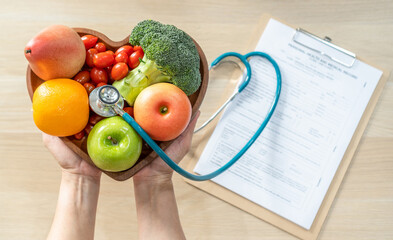 Nutritional food for heart health wellness by cholesterol diet and healthy nutrition eating with clean fruits and vegetables in heart dish by nutritionist and doctor recommended for patient well-being