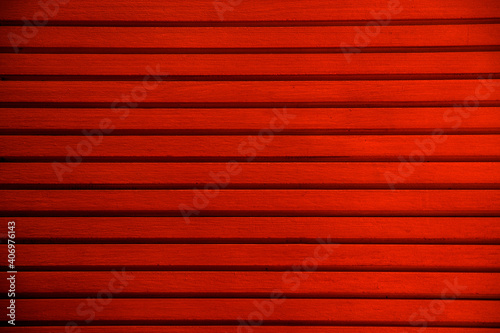 Red texture of pine wood grain with knots. Vintage red abstract background with wood pattern.