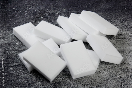 Melamine household sponge. Melamine sponges on dark background, tools for kitchen and home cleaning