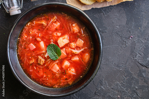 borscht red tomato soup first course bouillon meat and vegetables on the table meal snack keto or paleo diet outdoor top view copy space for text food background rustic image 
