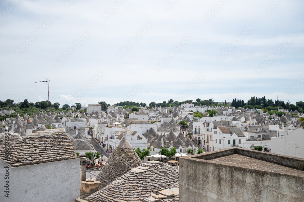 top view of Italian village Alberobello with Trulli house in Apulia, Italy. Unesco site in south of Italy. Italian culture lifestyle.
