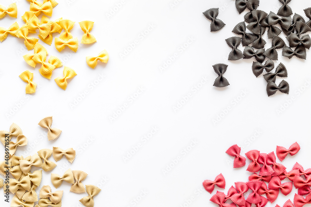 Frame of pasta - flay lay of Italian colorful farfalle, top view Frame of pasta - flay lay of Italian colorful farfalle, top view