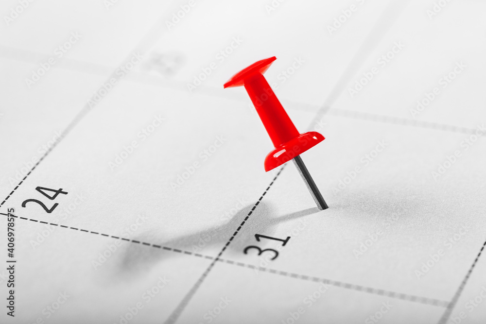 Important date and calendar appointment.Red pin on calendar.