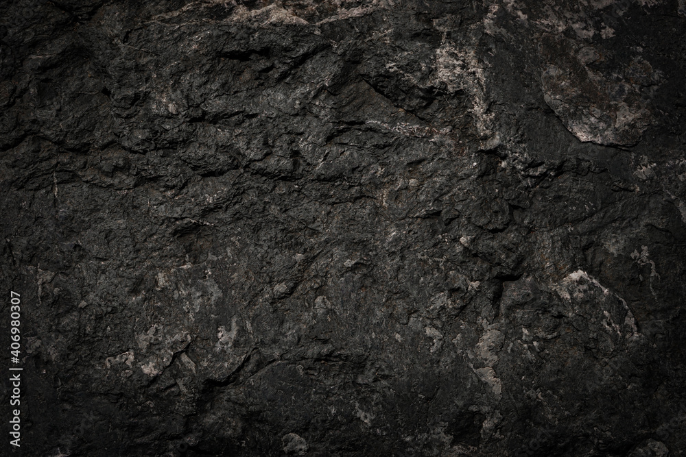 Black rough stone wall texture for background or wallpaper. Black rough stone wall texture for background or wallpaper.