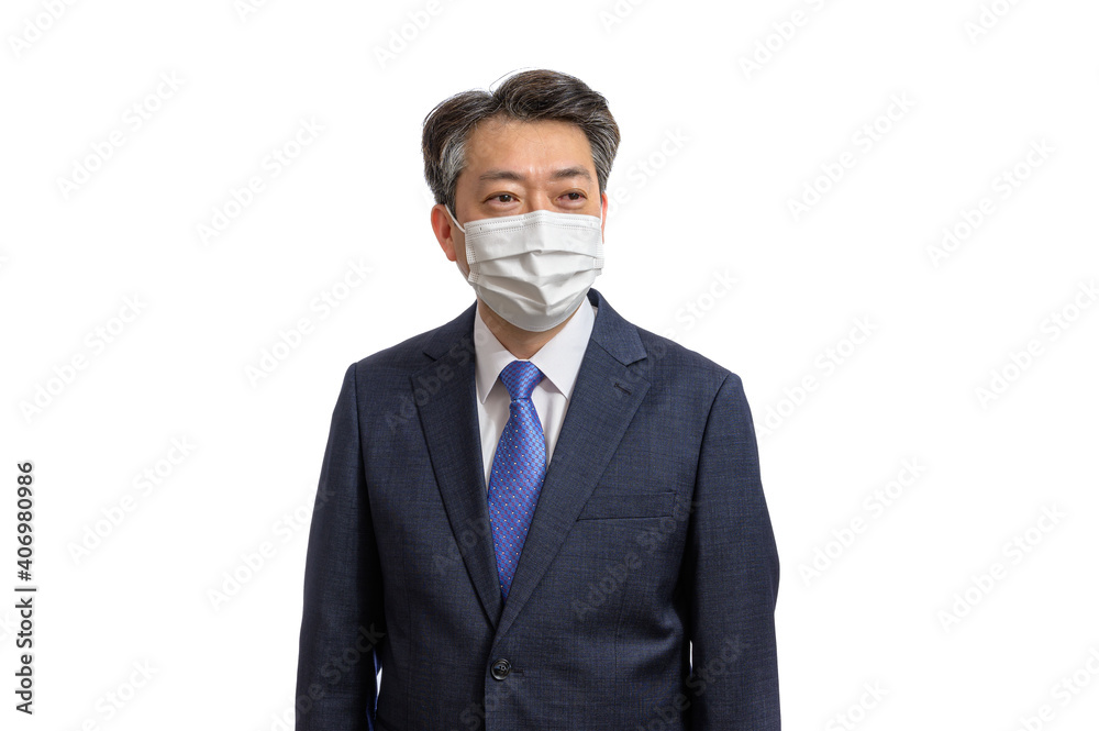 Portrait of a middle-aged Asian businessman wearing a white face mask. White Background. Covid19, Health, and Business Concepts. Portrait of a middle-aged Asian businessman wearing a white face mask. White Background. Covid19, Health, and Business Concepts.