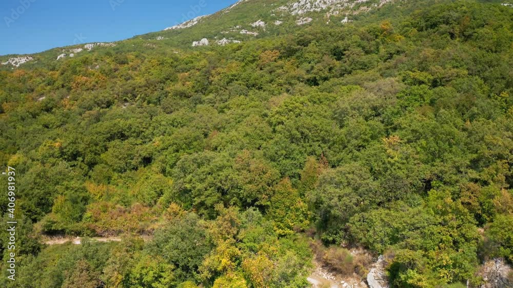 Top view from drone. Mount Chelobrdo above Budva. Country road high in the mountains. The road is high in the mountains. Montenegro. Mountains over Budva.
Top view from drone. Mount Chelobrdo above Budva. Country road high in the mountains. The road is high in the mountains. Montenegro. Mountains over Budva.