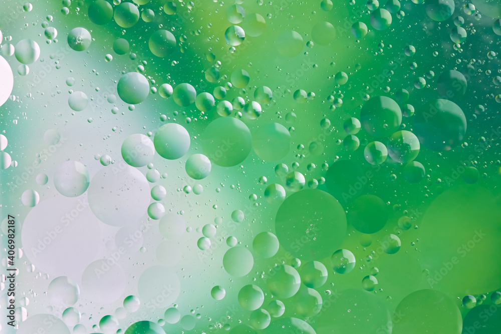 Oil and water round green different sizes bubbles for poster or wallpaper