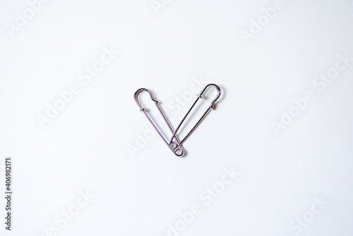Heart shaped metal pins. Concept for Valentine's Day