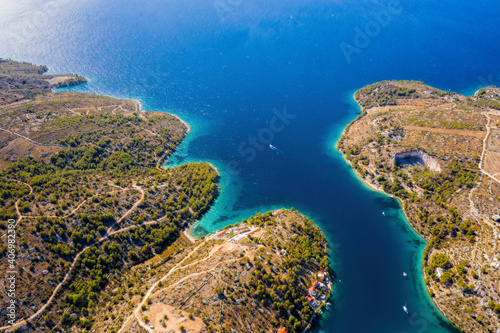 Sailing boats in quiet bay near village Milna on island Brac in Croatia. Aerial drone view in august 2020