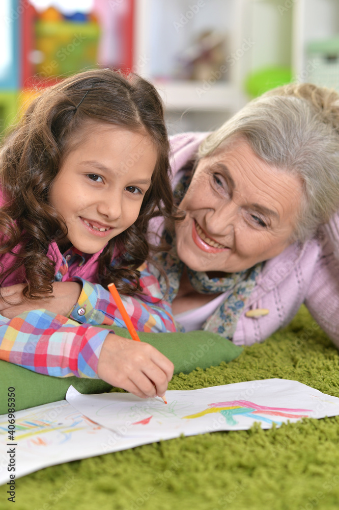 grandmother and granddaughter drawing together grandmother and granddaughter drawing together