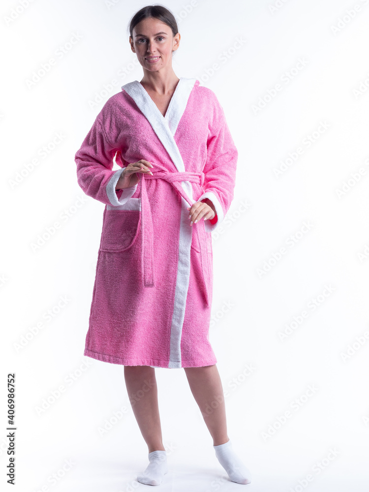 woman in a Bathrobe on an isolated white background with a smile on her face. woman in a Bathrobe on an isolated white background with a smile on her face.