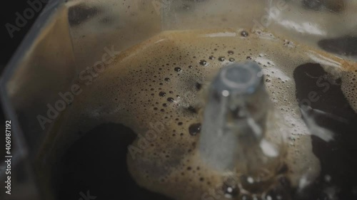 Italian moka pot making espresso coffee in macro