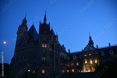 Moszna Castle in evening with blue sky