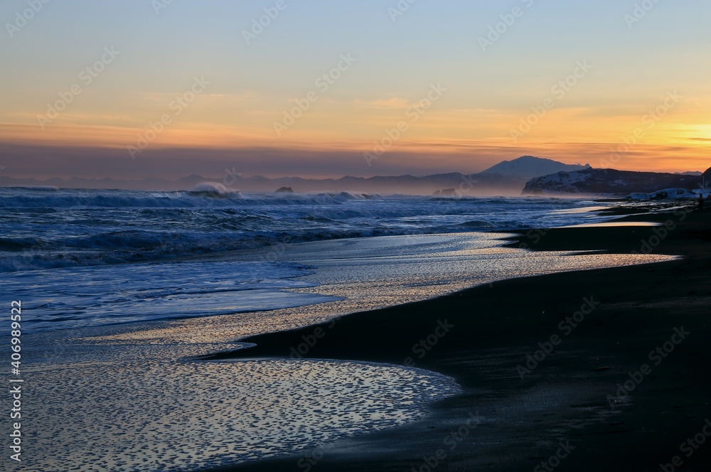 Sunset on Khalaktyrsky beach, Pacific Ocean, winter season, Kamchatka