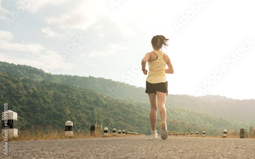 Empty road with running girl in background