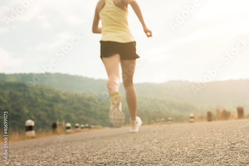 Empty road with running girl in background