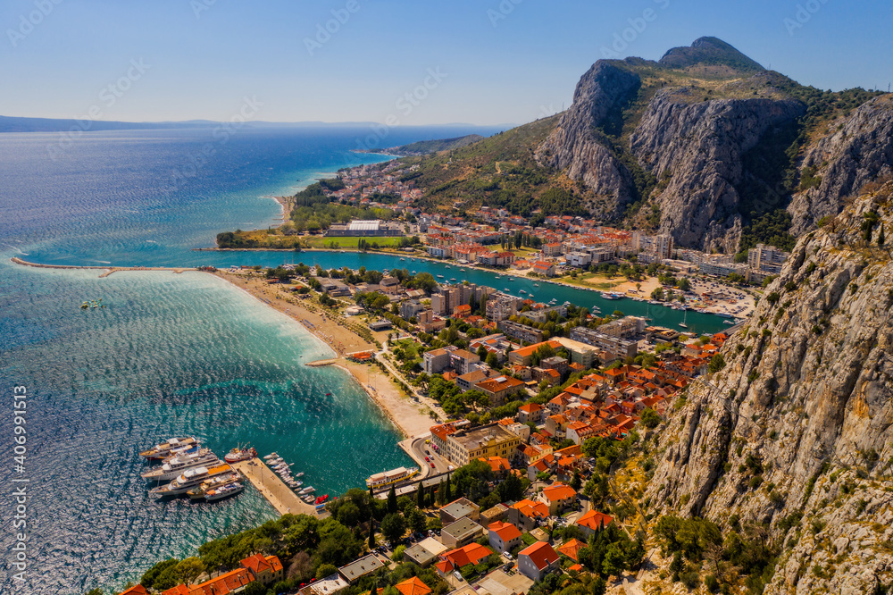 Panorama of town Omis in Croatia - travel background. Aerial drone picture in august 2020