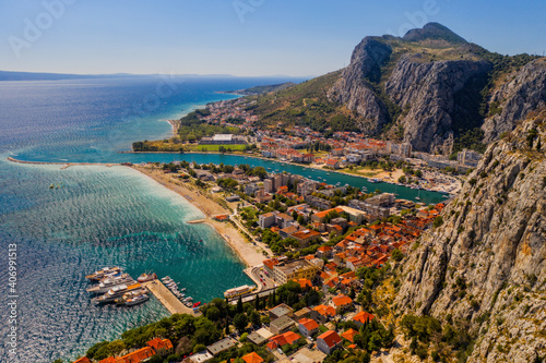 Panorama of town Omis in Croatia - travel background. Aerial drone picture in august 2020
