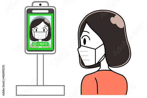 タブレット体温計で体温を測る女性