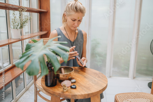 Woman is reading Tarot cards on a table in cafe photo