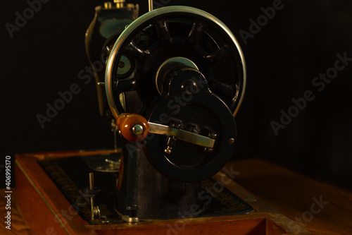 gray sewing machine on a black background