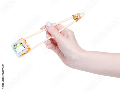 training sticks with sushi in hand on white background isolation
