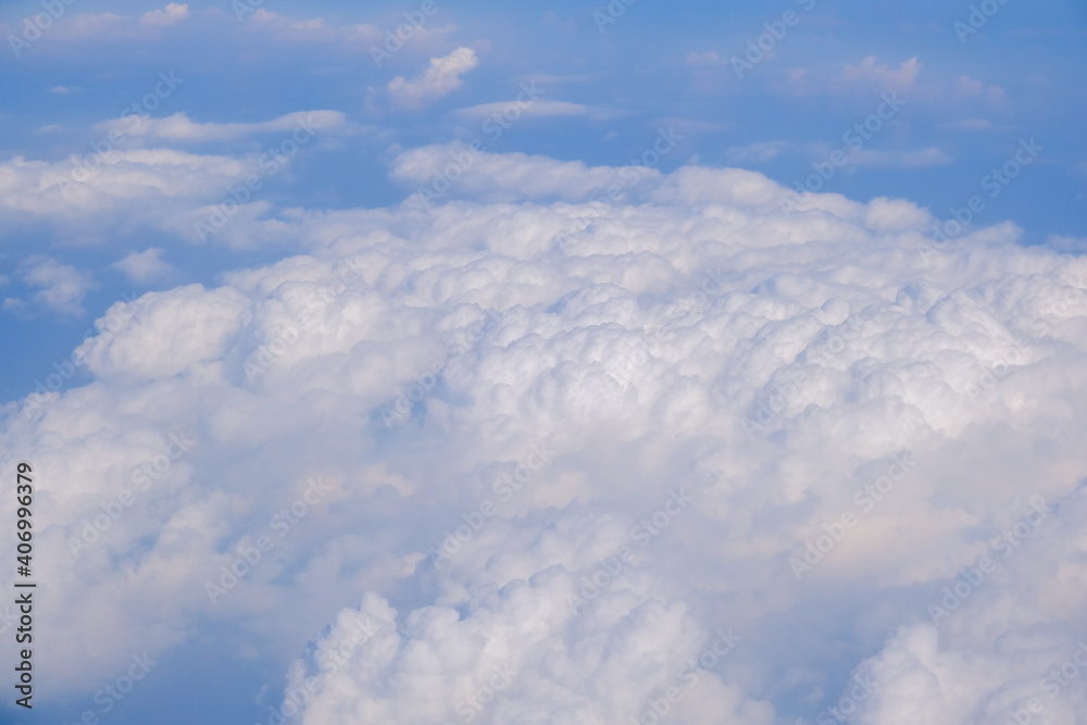 Blue sky background with tiny clouds from airplane Blue sky background with tiny clouds from airplane