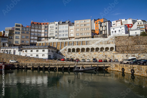 Partial view of the fishing and tourist town of Malpica in front of the port. Galicia. Spain photo