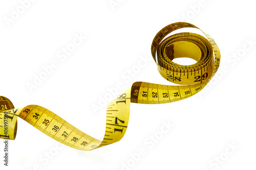 Yellow measuring tape on white background