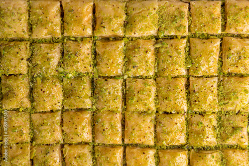 small baklava pieces with syrup and peanut on a close look
