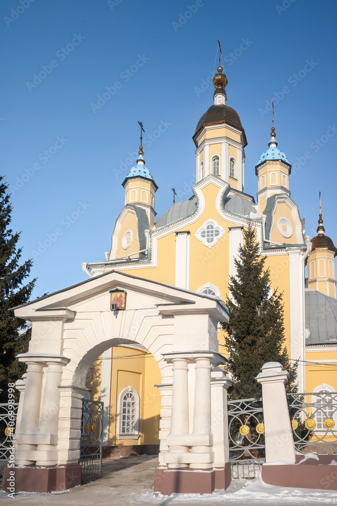 Golden domes of a christian temple against the blue sky in winter