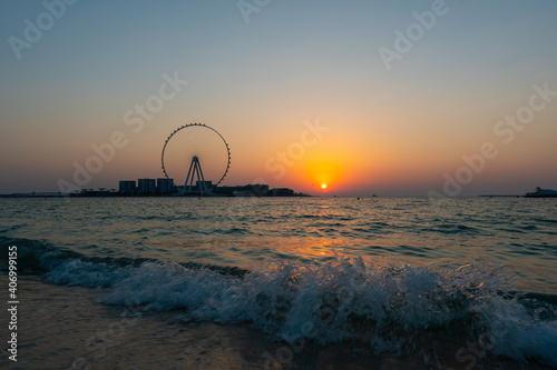 Photography Sunset over the sea view to the Dubai Eye giant Ferris at artificial island Bluewaters Island  close to JBR beach