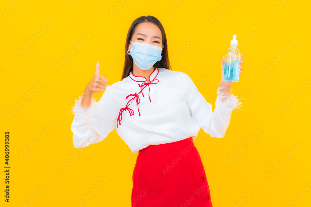 Portrait beautiful young asian woman wear mask and use alcohol gel for protect covid19 Portrait beautiful young asian woman wear mask and use alcohol gel for protect covid19
