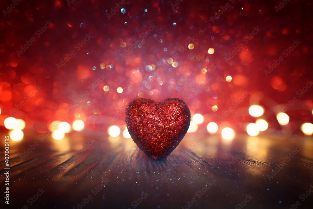 Valentine's day concept. Glitter red hearts over shiny background Valentine's day concept. Glitter red hearts over shiny background