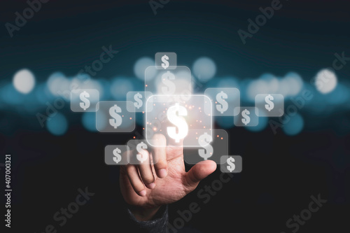 Hand touching to virtual US dollar sign with blue bokeh background, USD is United state of America currency which is the main exchange and popular in the world.