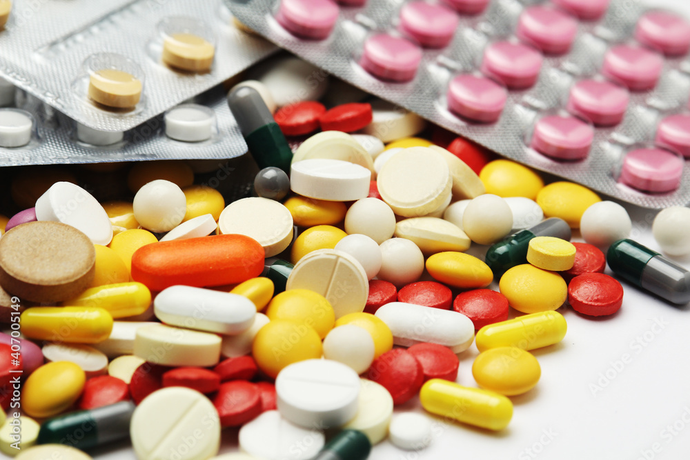 Different colorful tablets at white background Different colorful tablets at white background