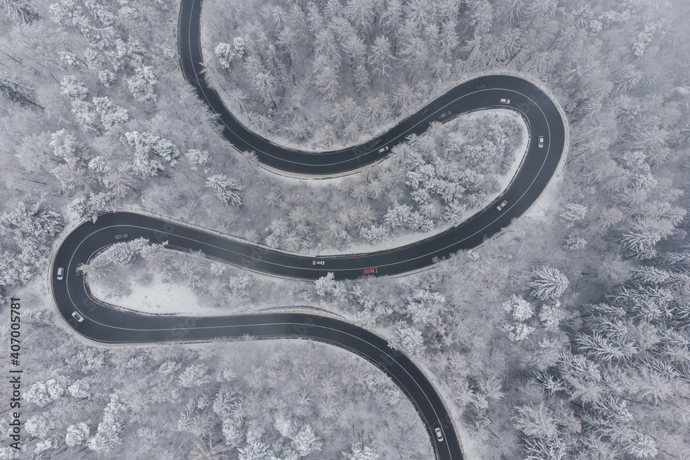 Aerial winter view of the curvy mountain road, in Poiana Brasov