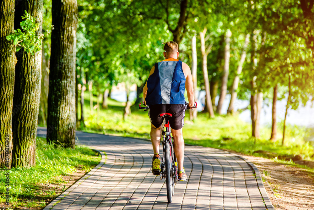 Cyclist ride on the bike path in the city Park
Cyclist ride on the bike path in the city Park