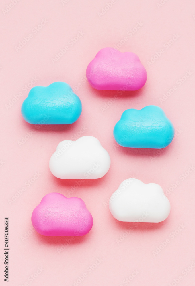 Fototapeta premium cute clouds on a pink background. baby or newborn background